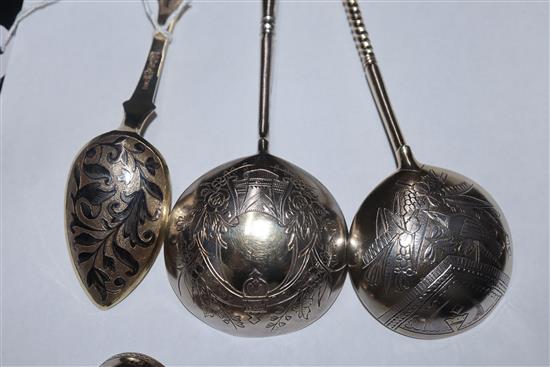 A Russian 84 zlotnik silver gilt and niello spoon, assay master probably Andrei Koralsky, 1842, L 17.5cm and four other Russian spoons